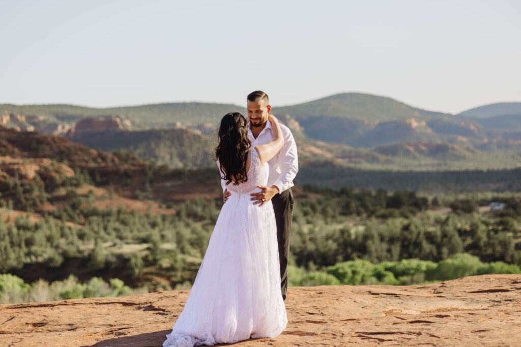 bride and groom holding eloping in Sedona Arizona 