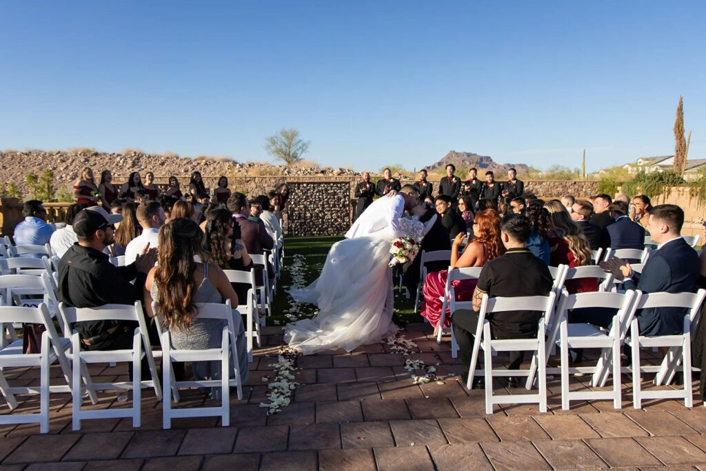 Bride and groom aisle kissing at The venue on 55th place