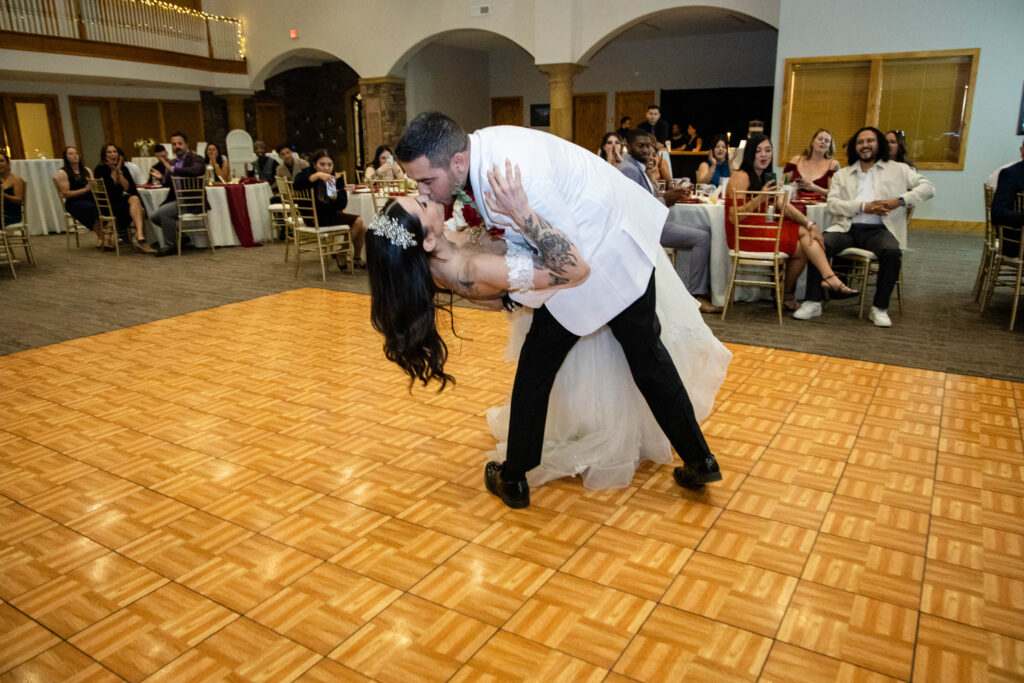 Bride and groom dancing in the middle of the dance floor