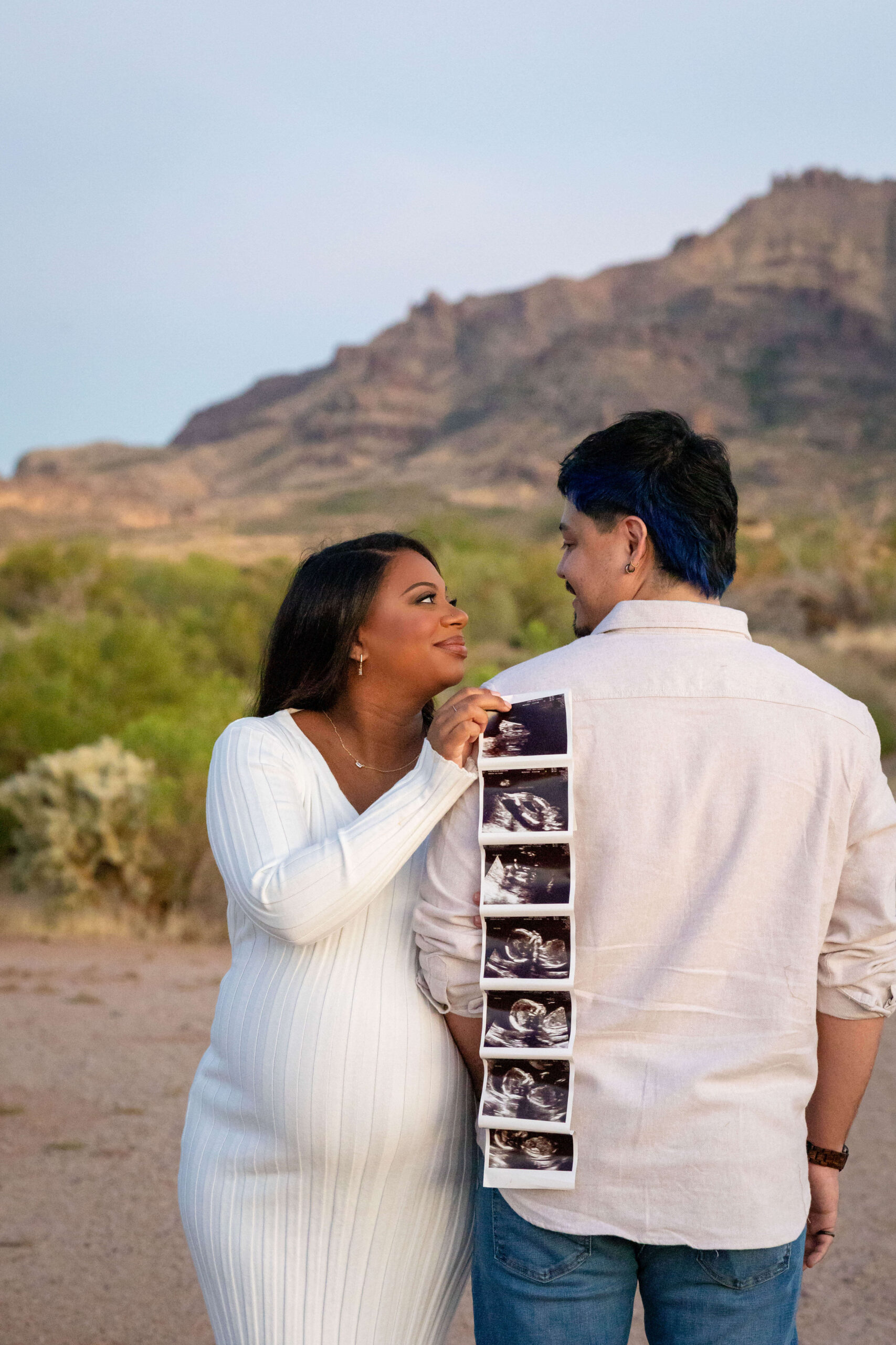 Natural-desert-maternity-session-in-Phoenix-with-mom-standing-among-cacti-and-mountain