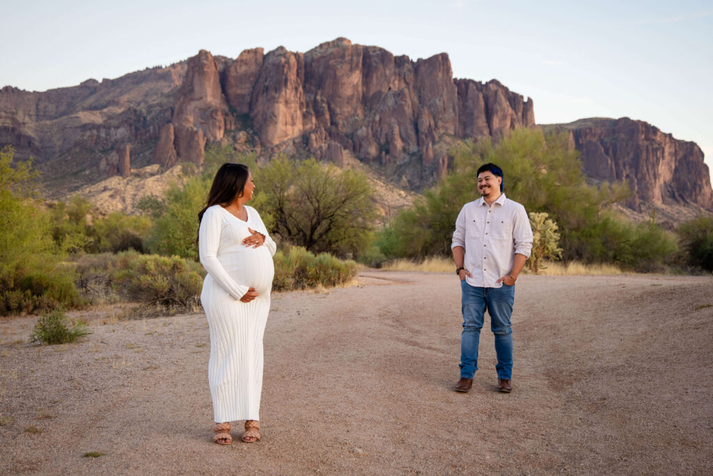 Phoenix-maternity-photography-session-with-mom-walking-through-desert-landscape-scaled
